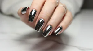 Chrome nails with rhinestone accents for a subtle glamorous look