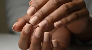 Caramel nude nails for dark skin tone with clean natural look