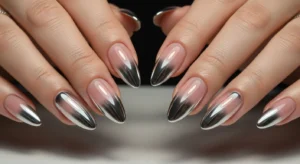 Chrome ombre nails with gradient fade from metallic to nude base