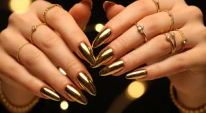 Gold chrome nails with shiny metallic finish and luxe aesthetic
