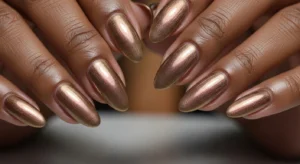 Bronze shimmer nails on dark skin for fall glow