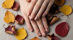 Minimal leaf nail art for Thanksgiving fall nail designs