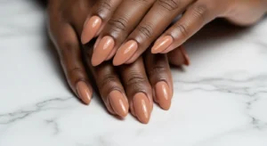Warm nude almond nails for Black women natural polished look