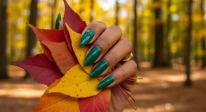 Forest green fall nails on dark skin with glossy finish