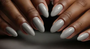 Light gray almond nails modern style on dark skin