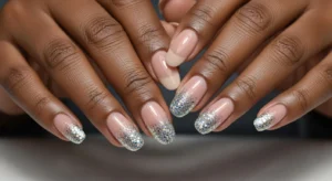 Glitter tip nails on dark skin with subtle sparkle