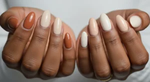 Neutral mix nail design on dark skin with fall tones