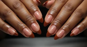 French fade nails on dark skin with brown tones