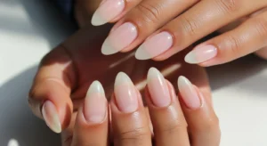 Clear glossy almond nails natural clean look on dark skin