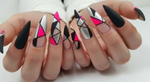 arrowhead nail shape with sharp angles creating edgy nail appearance