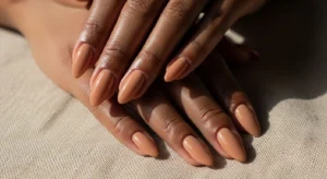Caramel nude nails on dark skin natural glowing manicure