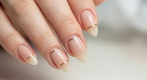 Nude nails with gold accent elegant nail design