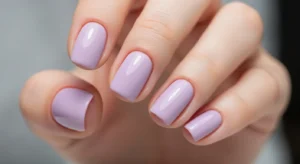 soft lavender glossy nails on short nails creating a light, fresh, and feminine everyday manicure look