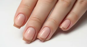 Nude French tip nails modern neutral manicure