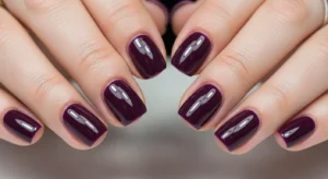 deep plum nails with dark purple shade for bold, rich, and elegant manicure style