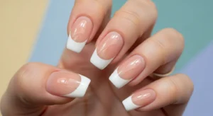 classic white french tip acrylic nails with nude base and clean white tips for timeless manicure