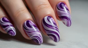 pastel purple nails with mixed shades for trendy and playful manicure look