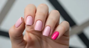 Short pink manicure with one bold hot pink accent nail