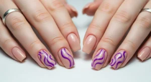 purple swirl nail design with soft flowing patterns for modern creative manicure