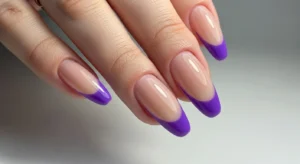 purple french tip nails with nude base and colored tips for modern and minimal manicure