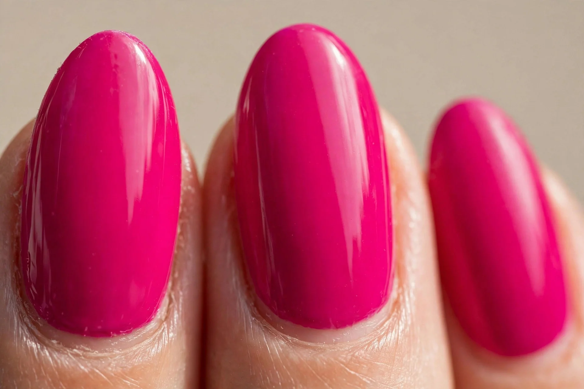 bold opaque fuchsia-pink creme on medium almond nails, glossy