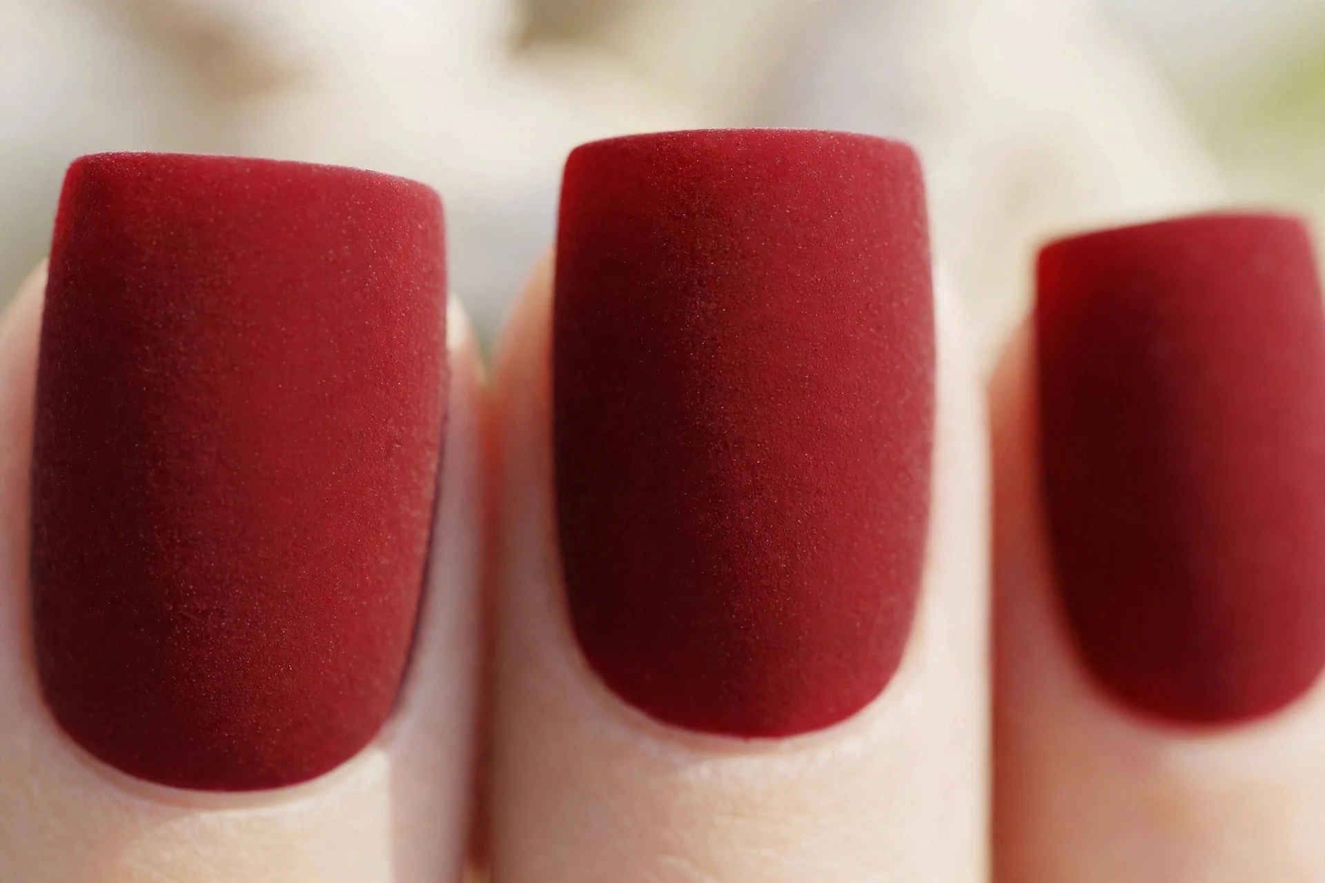 Oxblood polish with velvet matte finish, medium square nails