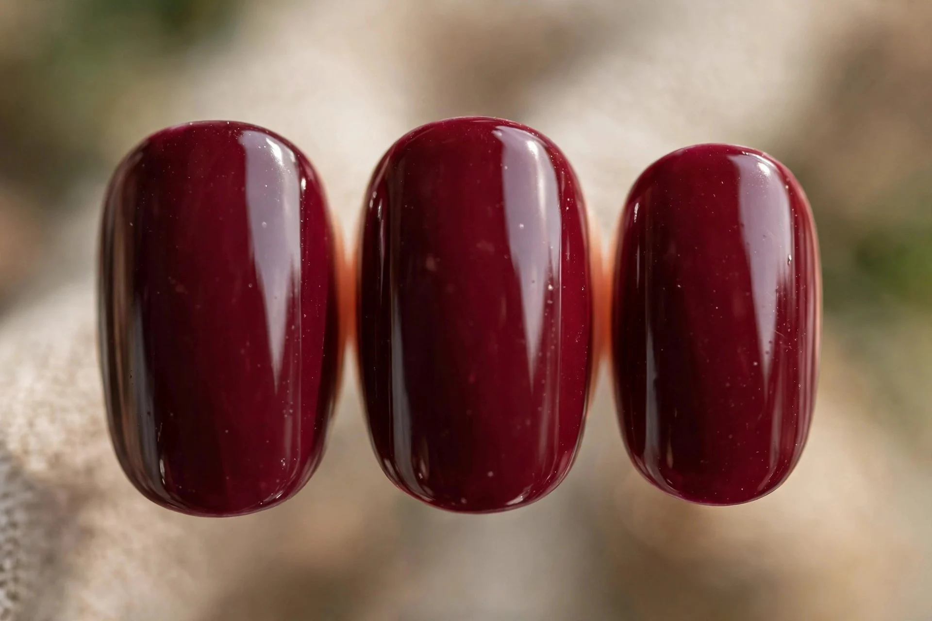 Classic true burgundy wine polish, short oval nails, glossy
