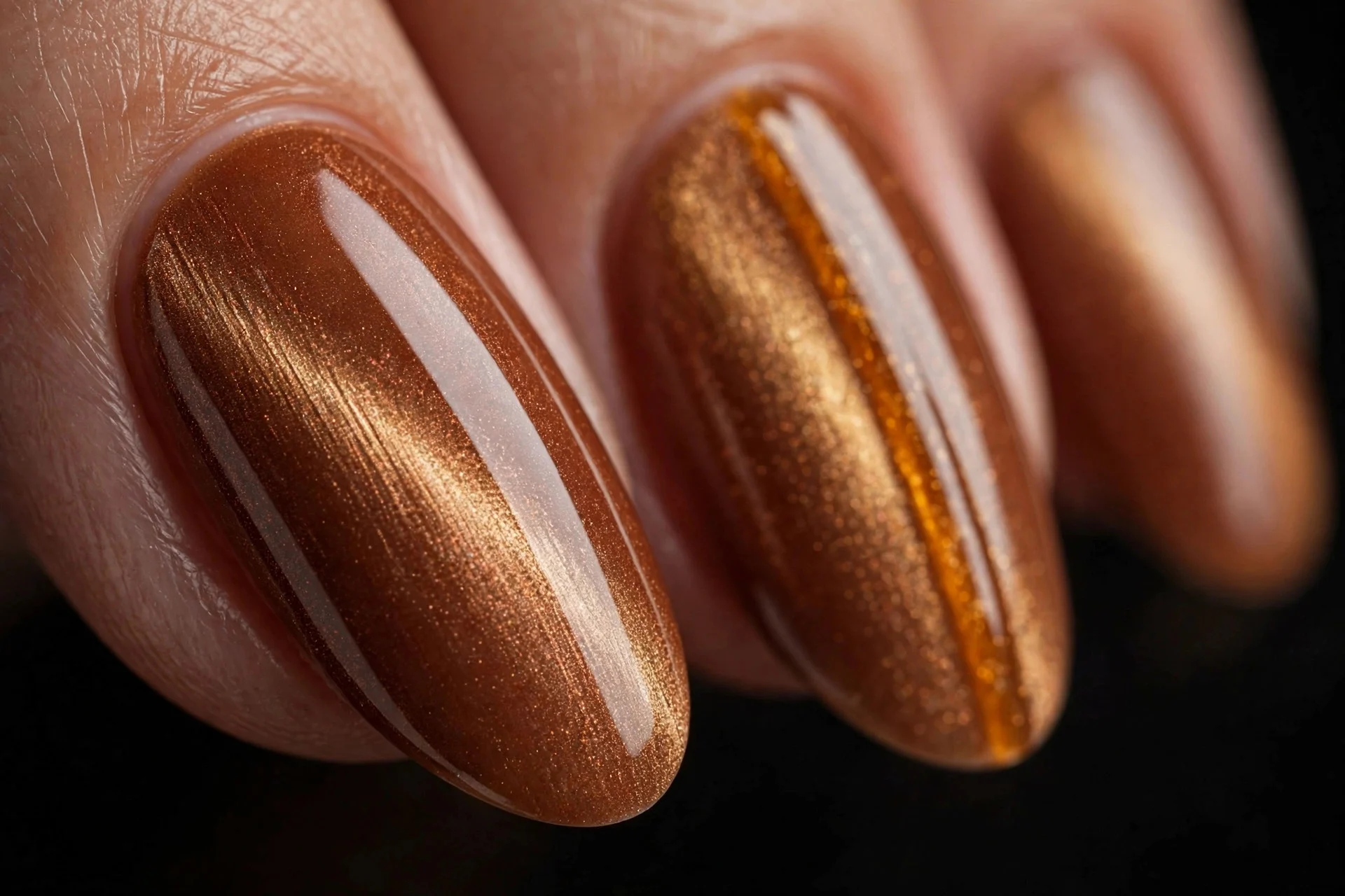 Almond nails with cinnamon magnetic cat-eye polish, amber stripe, glossy, dark background