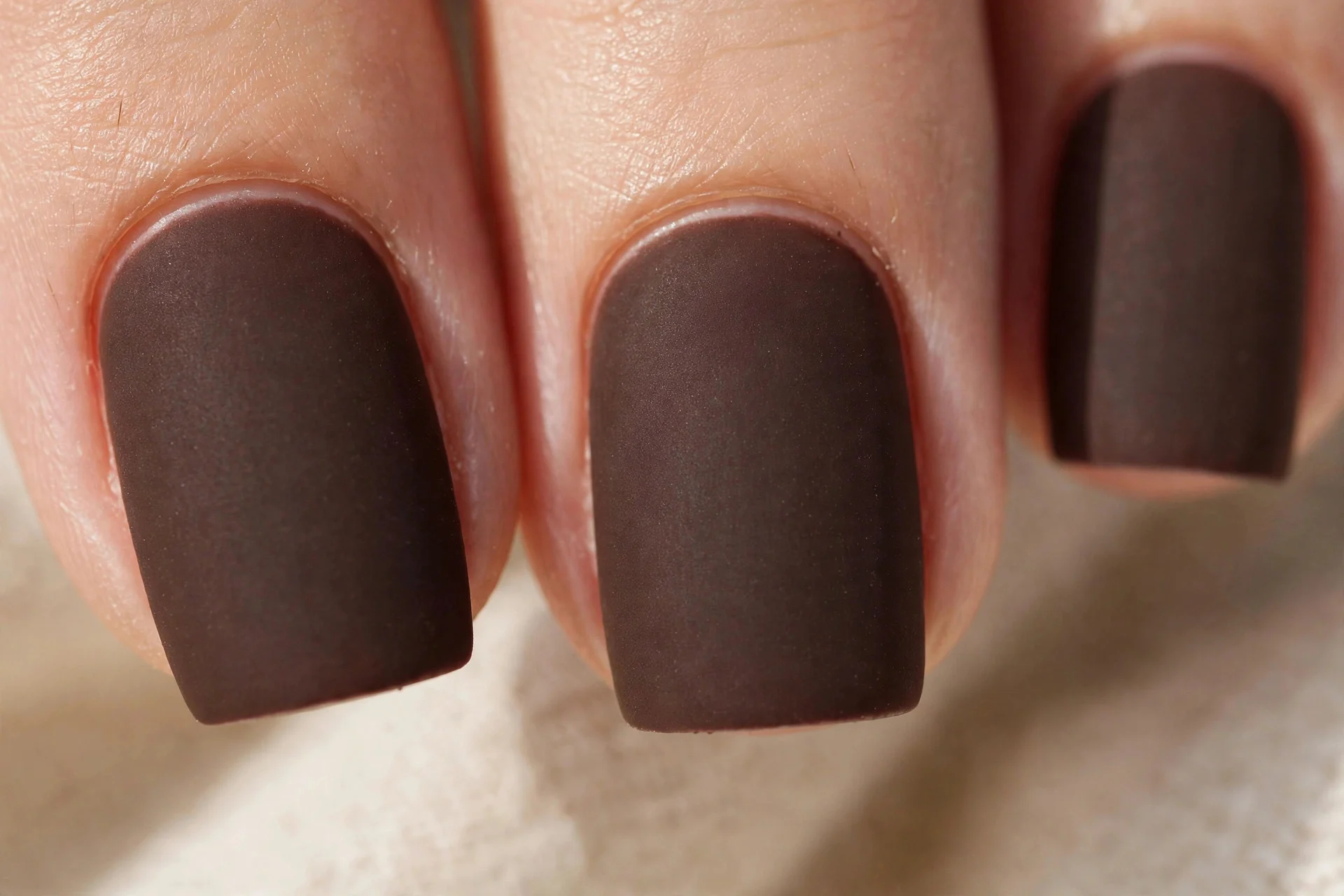 medium-length square nails in matte dark chocolate brown