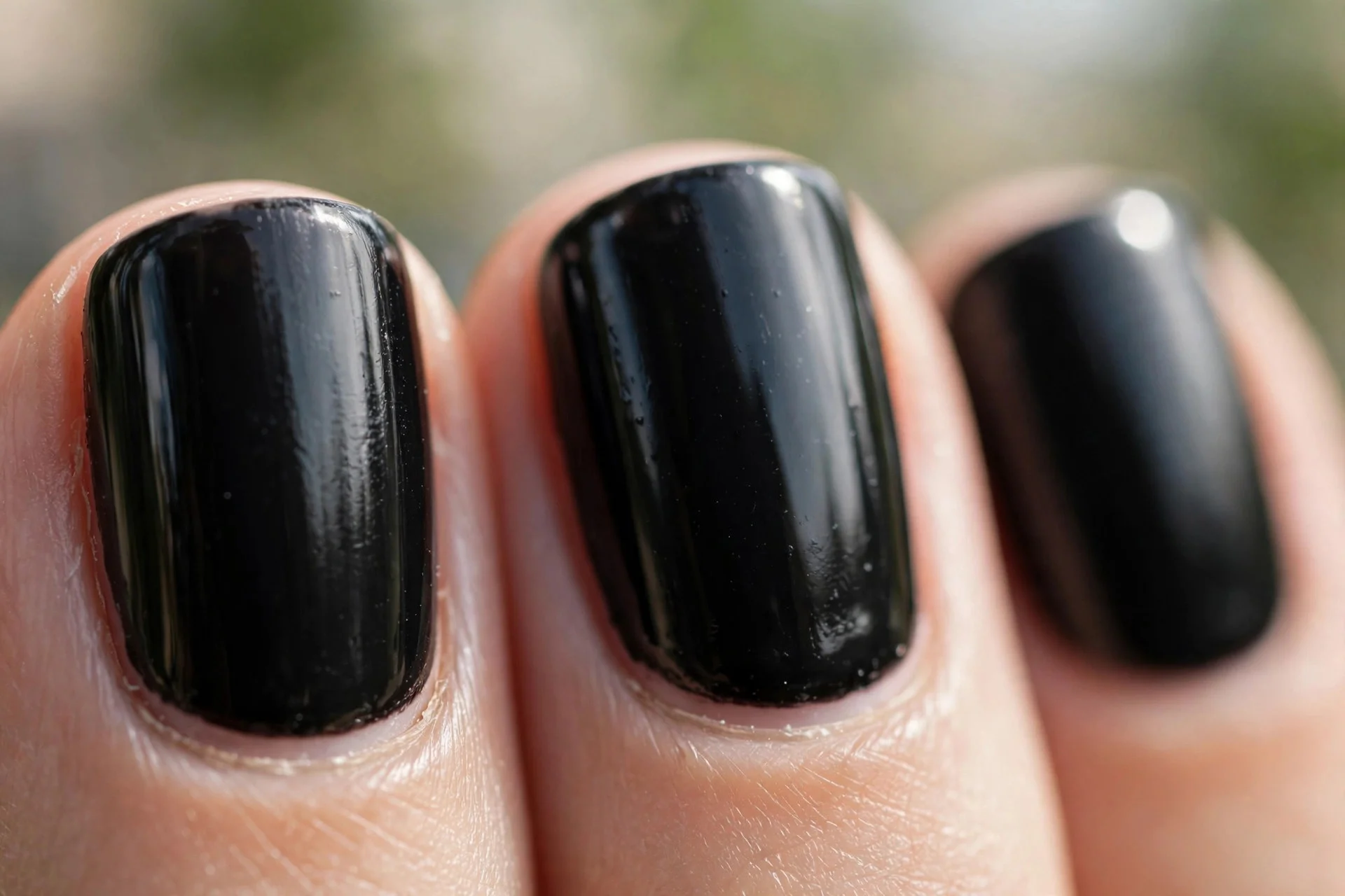 short squoval nails in glossy jet black polish