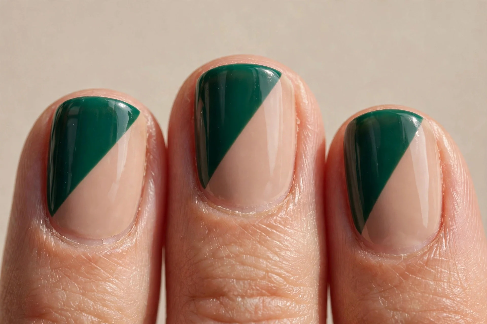 Emerald and nude colour-block, diagonal split, squoval.