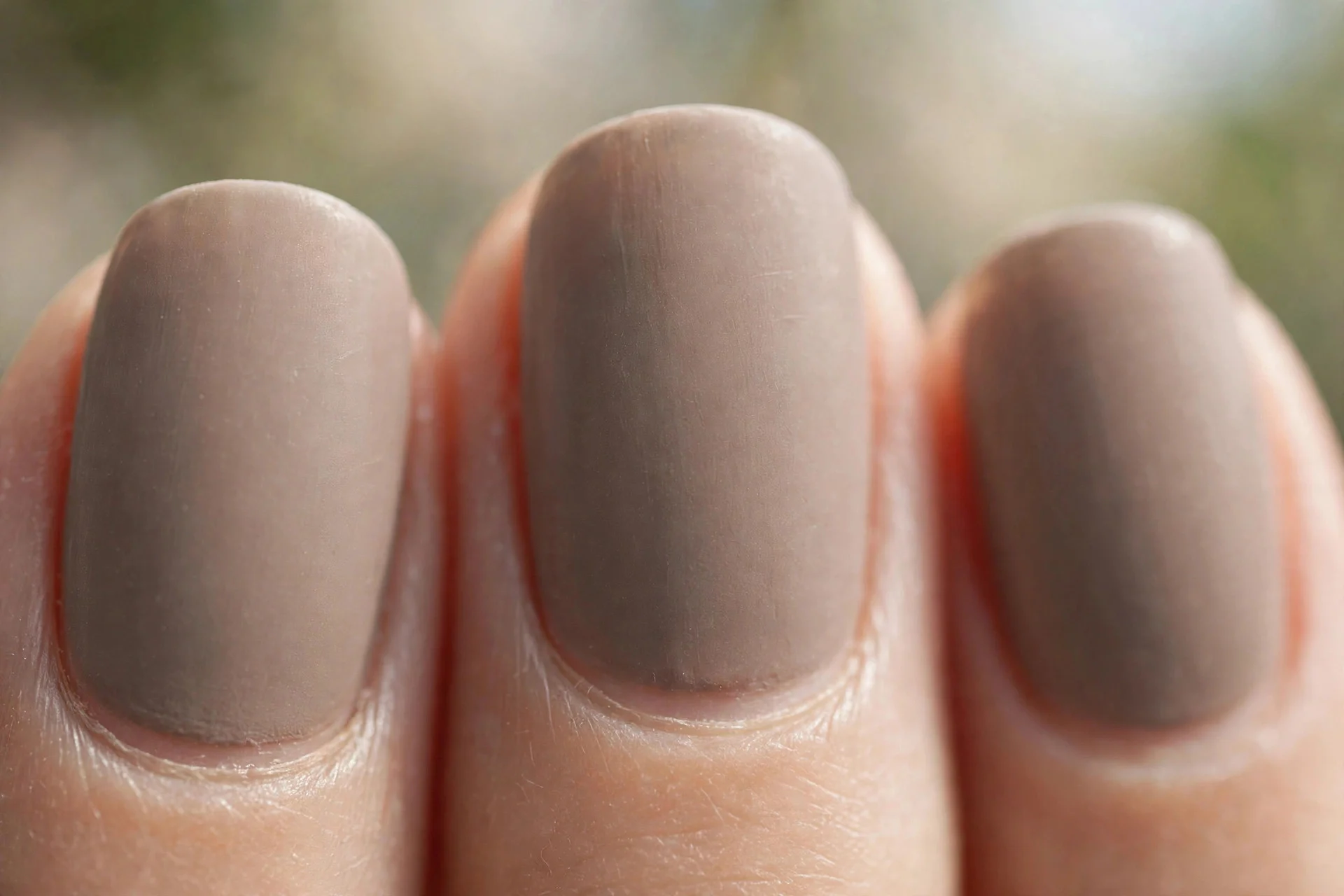 Short almond nails in soft taupe, matte finish