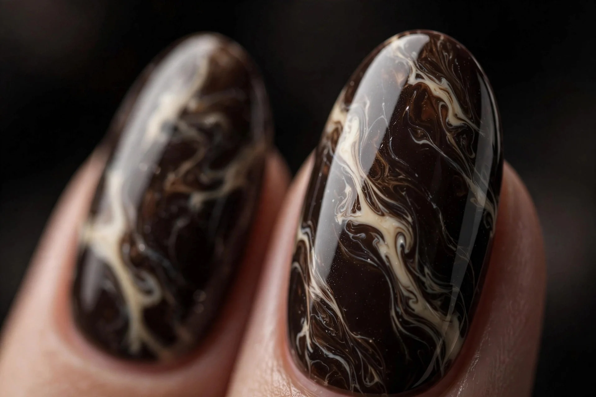Almond nails with cream marble veining through deep espresso, glossy, dark background