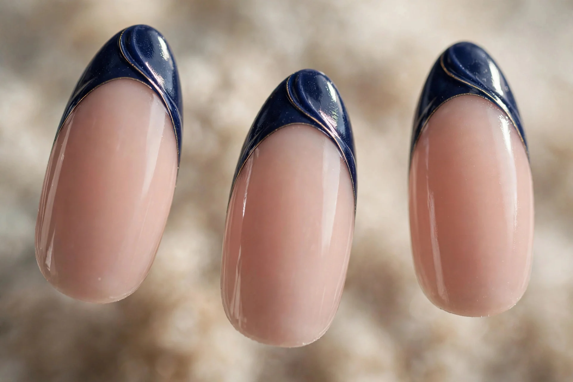 Nude nails with navy blue French tips, almond