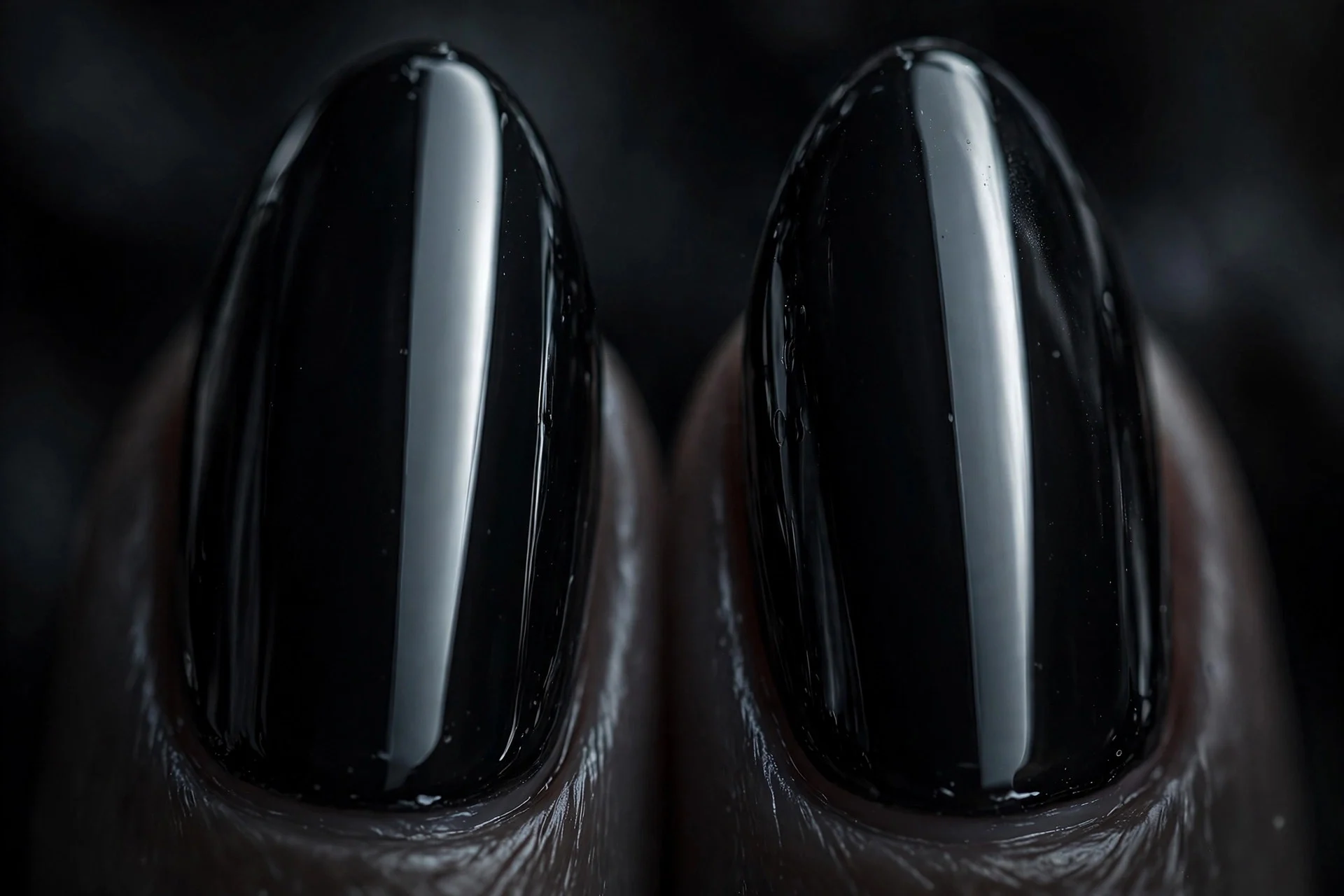Extreme macro of two almond fingernails in true black cat-eye gel with a razor-sharp vertical light band, liquid-mirror finis