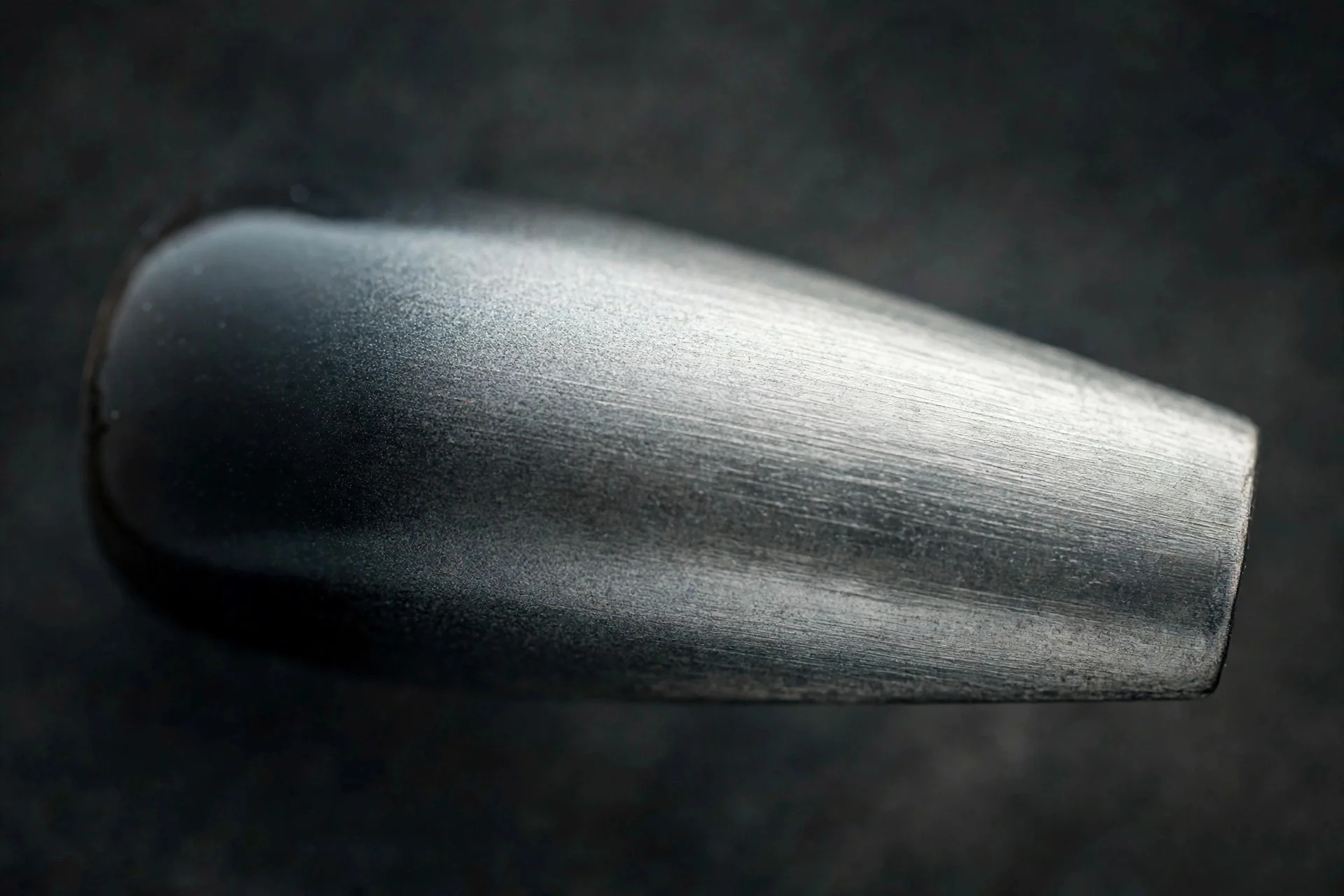 Coffin fingernail with charcoal ombre and brushed silver chrome satin finish, antique-mirror look, dark background