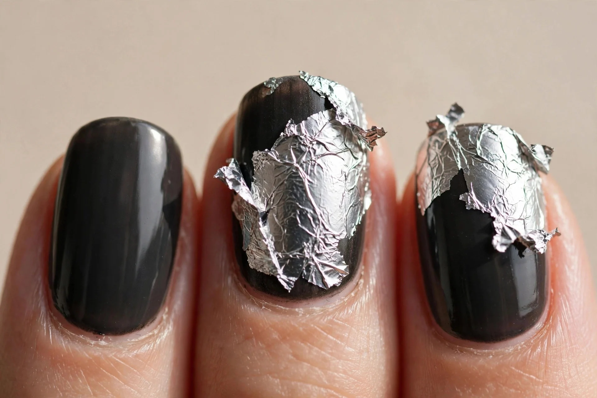 deep graphite nails, torn silver foil on two accent nails, glossy
