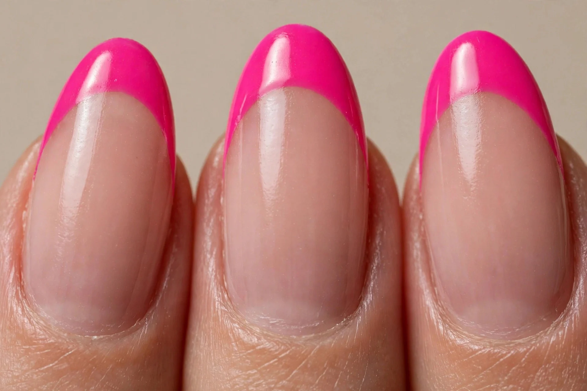 almond nails, nude base, hot pink French tips, glossy
