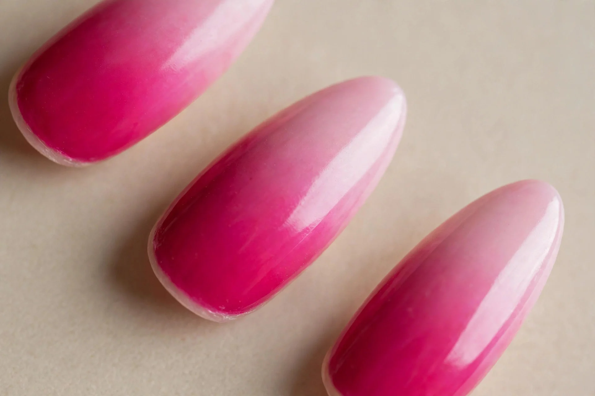 long almond nails, fuchsia-to-pale-pink ombr&eacute;, glossy
