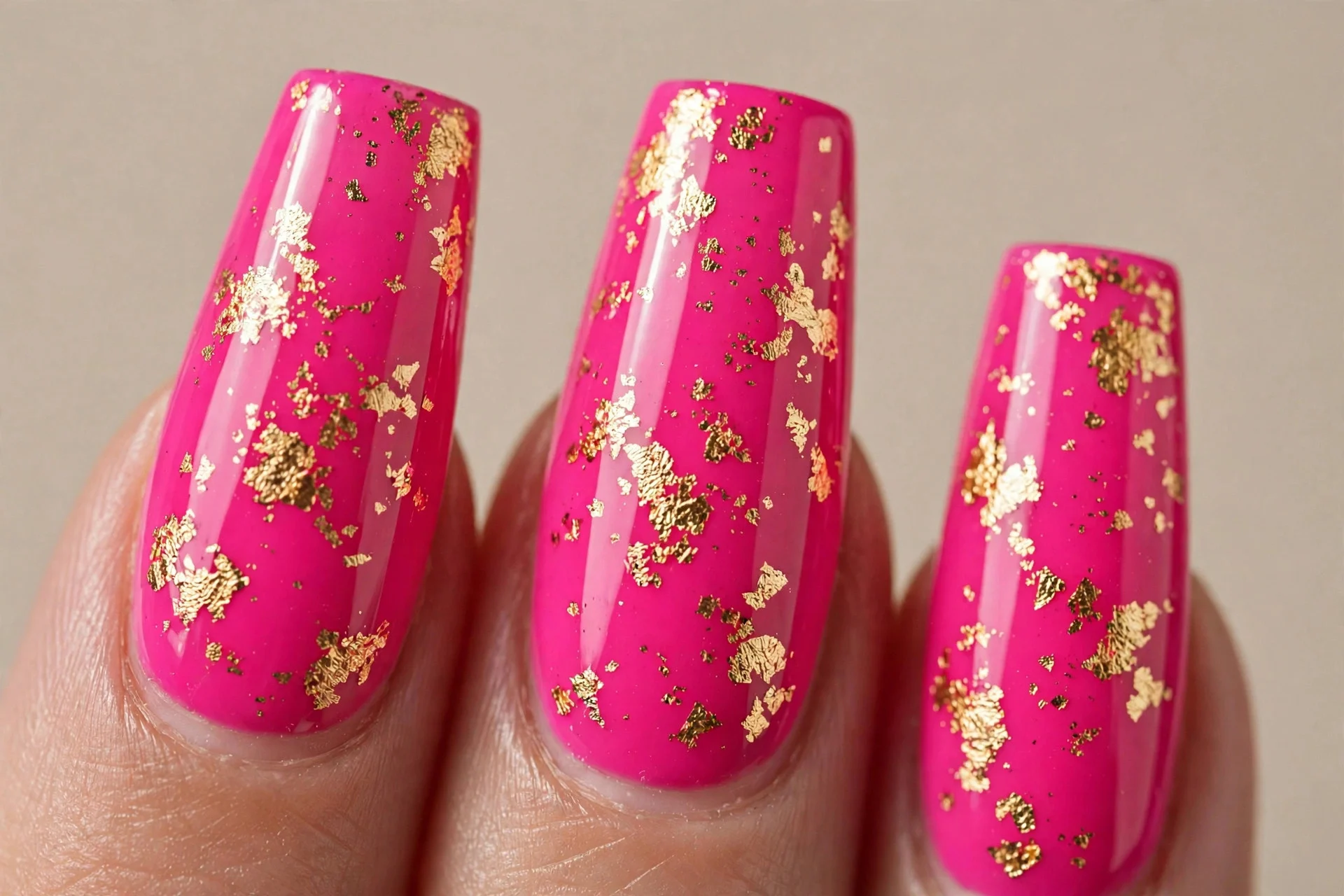 coffin nails, vivid hot pink with gold foil flakes, glossy