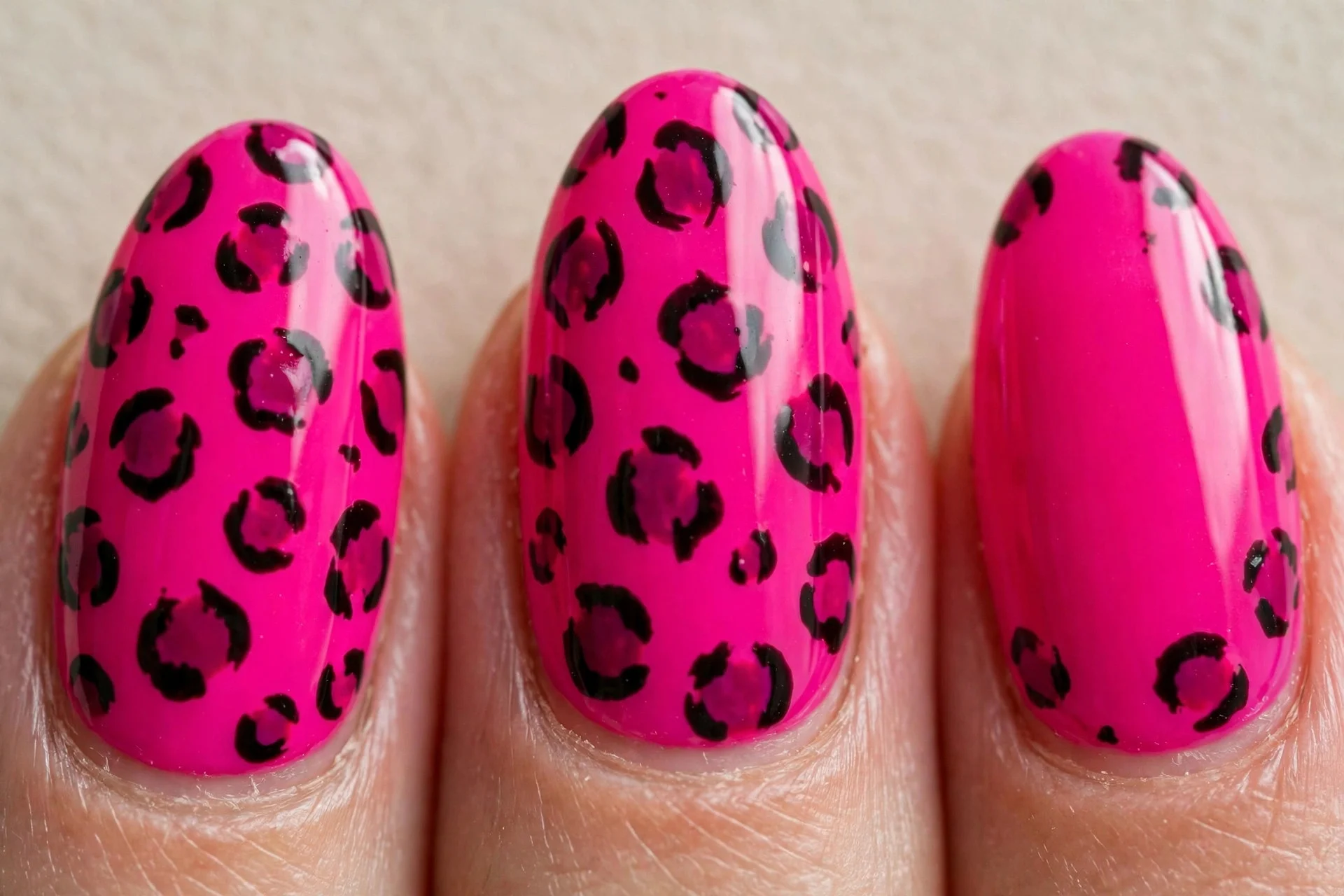 almond nails, hot pink with leopard spots, glossy