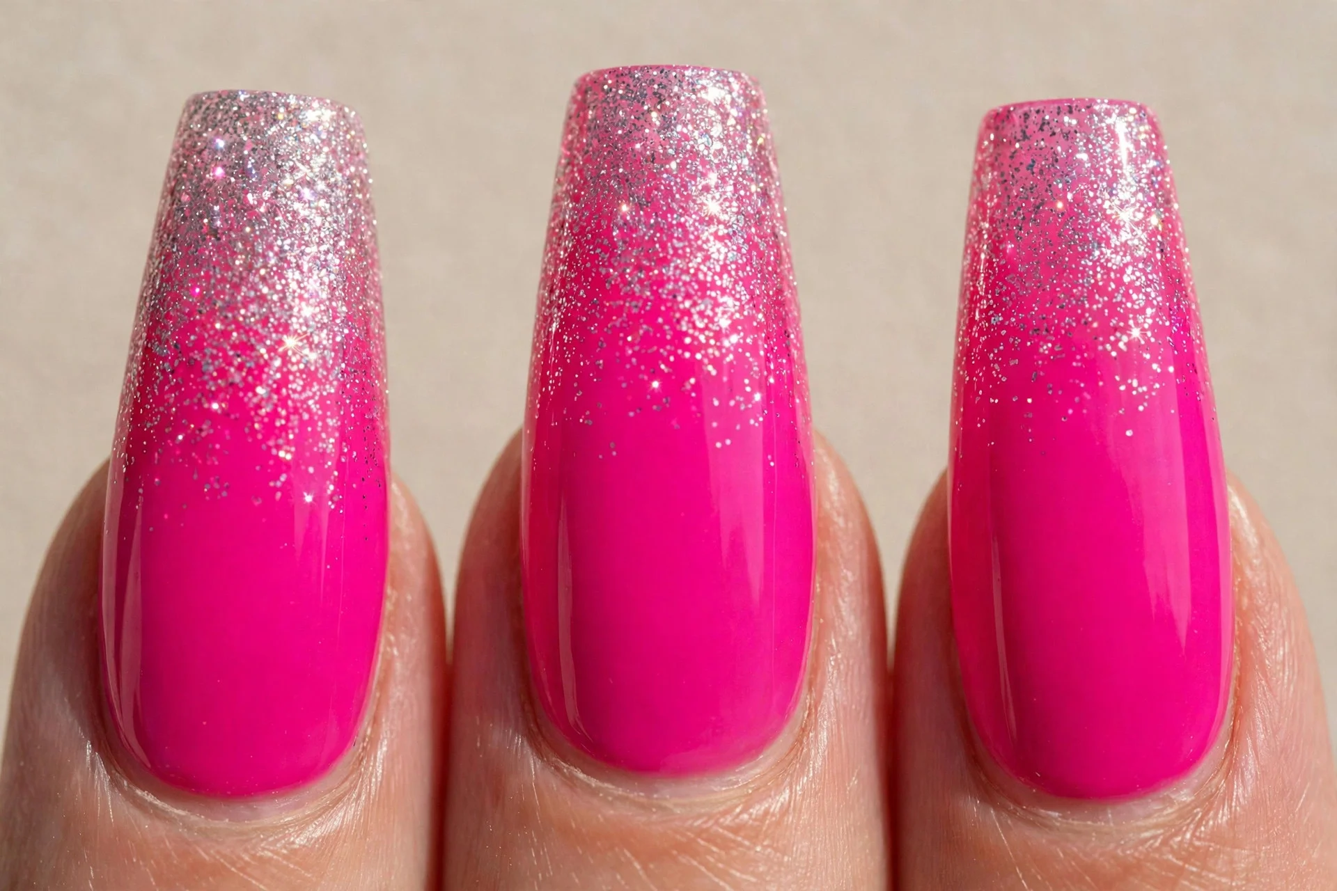 coffin nails, hot pink with glitter fade at tips, glossy