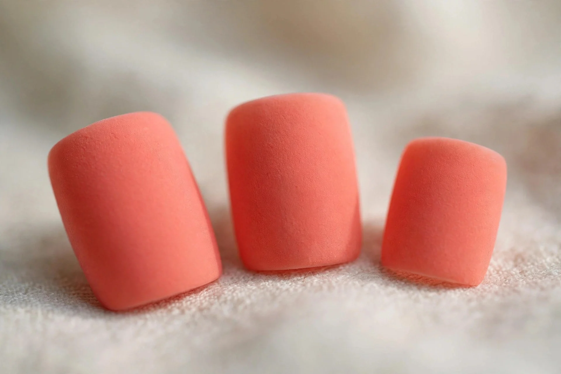 Coral manicure flipped to velvety matte finish, short square nails