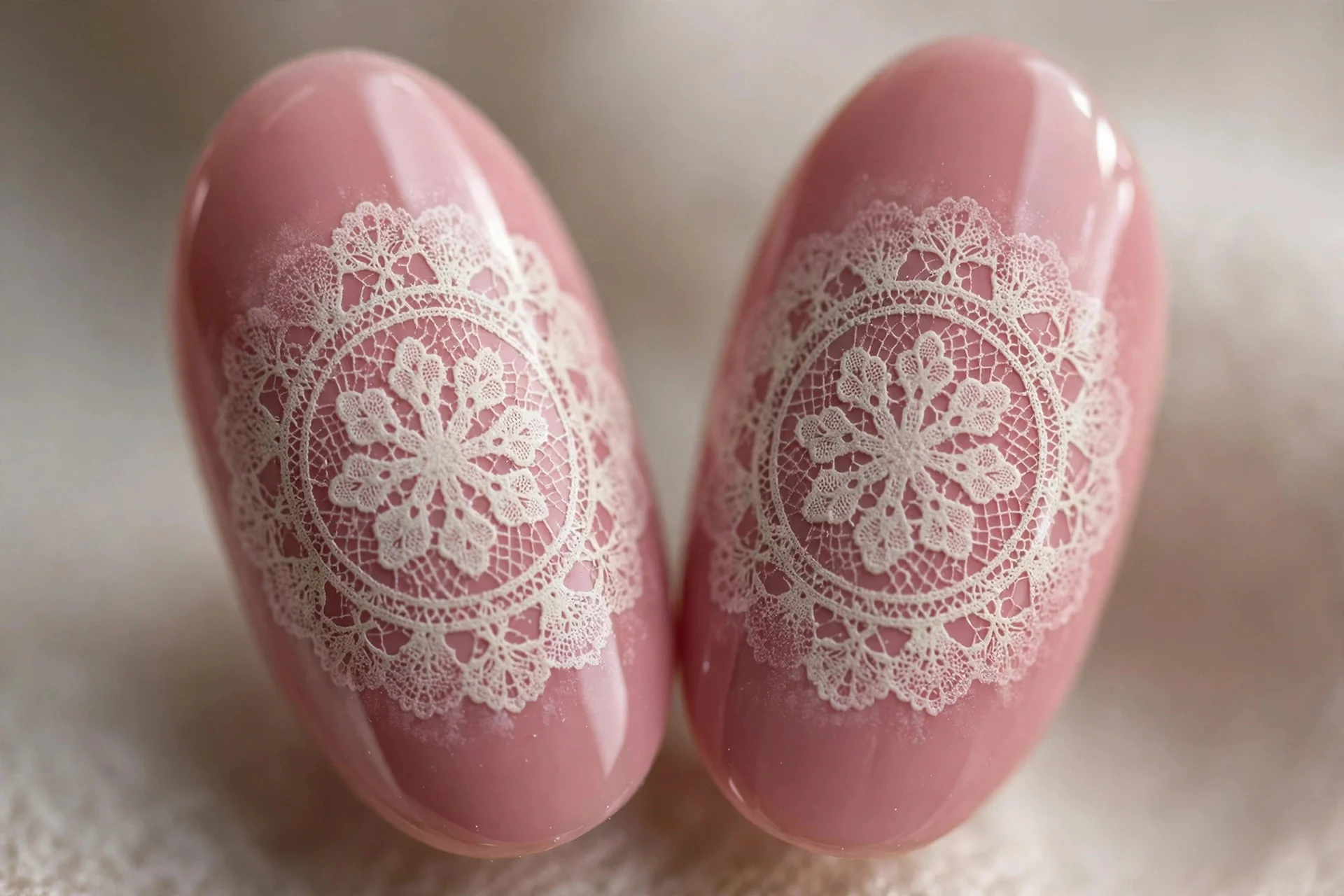 Almond nails with large vintage doily lace stamp over dusty rose, faded edges, glossy, neutral background
