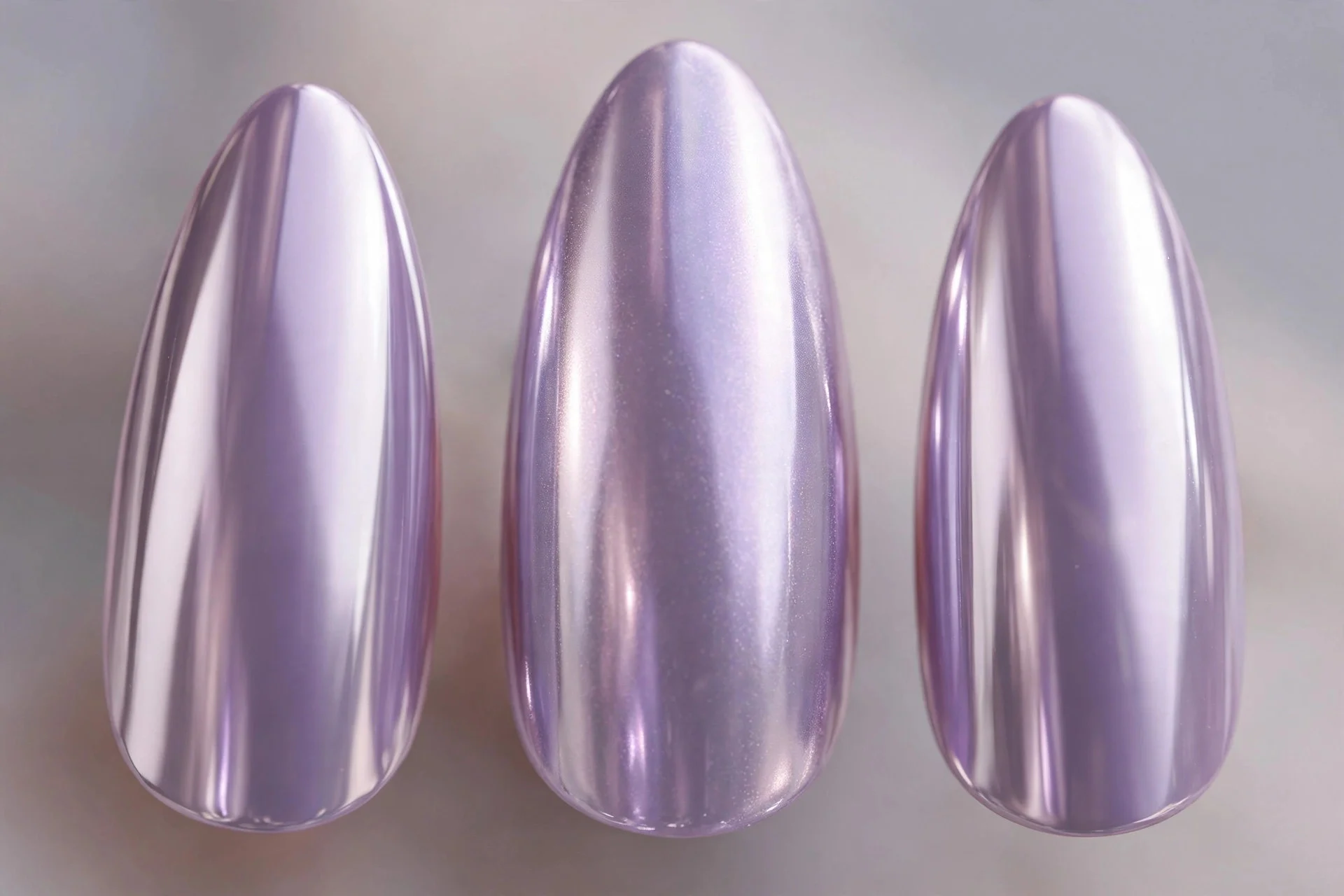 Mirror-bright lavender chrome nails, long almond nails, metallic pastel shine