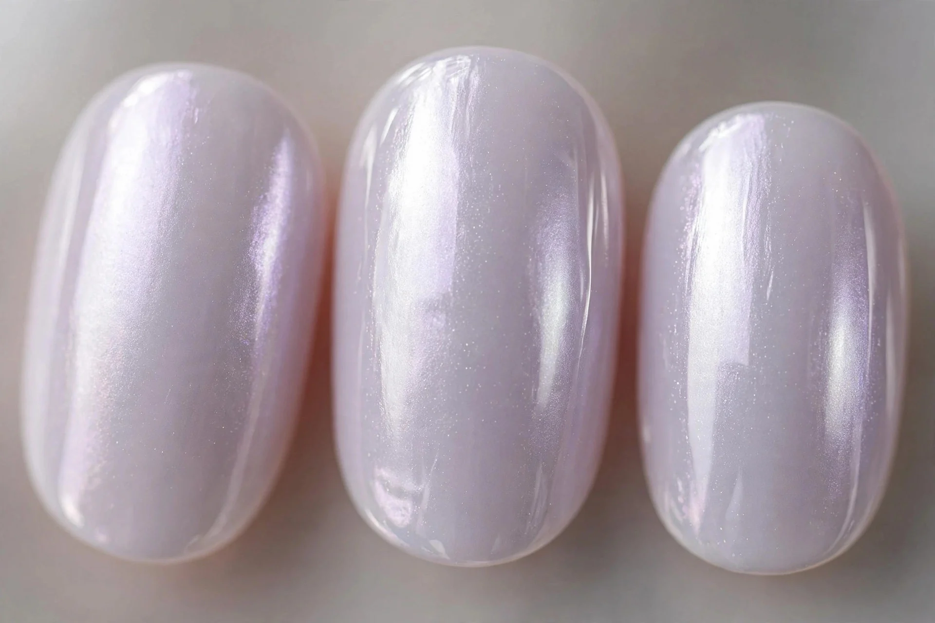 Milky lavender nails with pearl chrome glaze, short oval nails, luminous