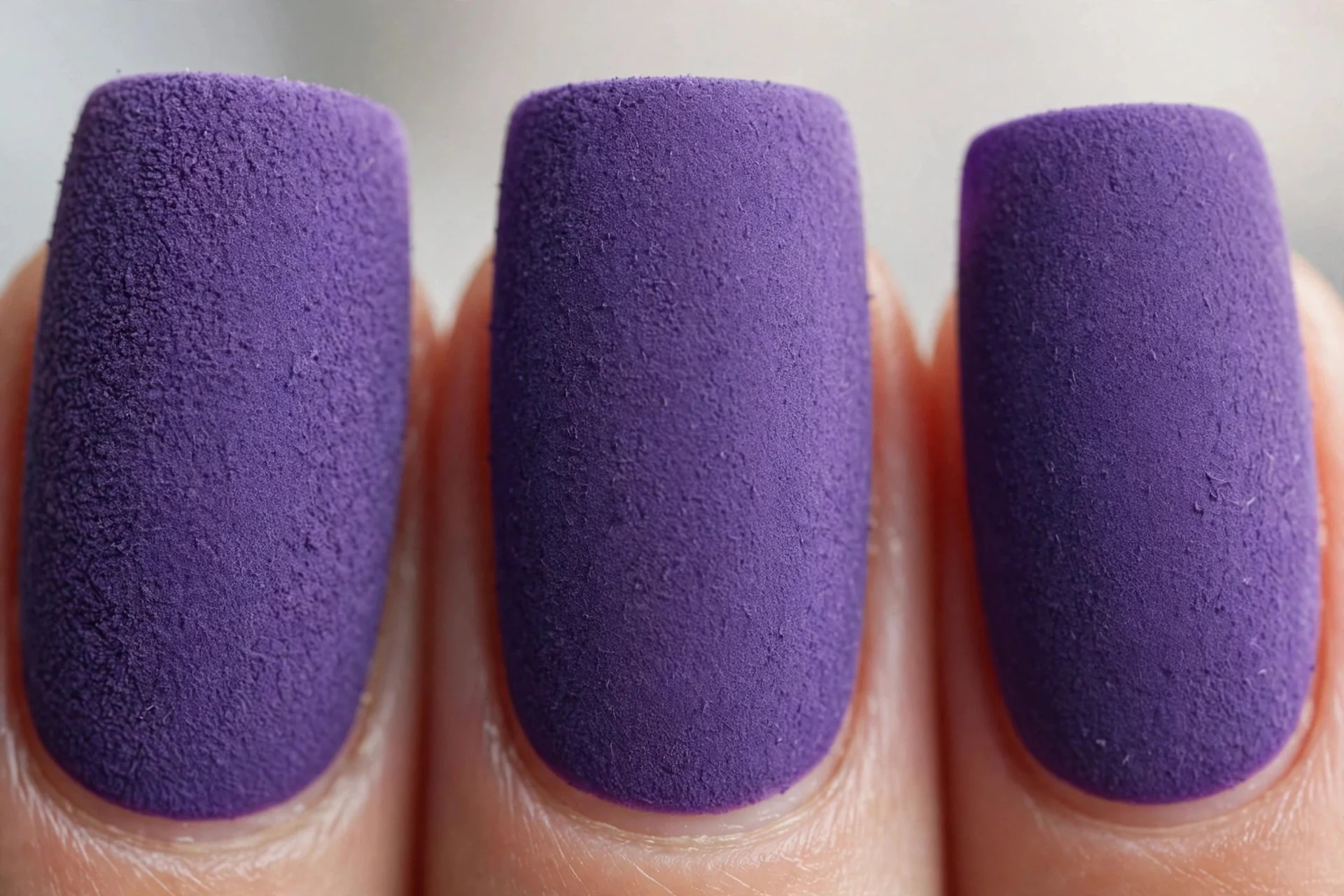 Deep violet-lavender matte suede nails, medium square nails
