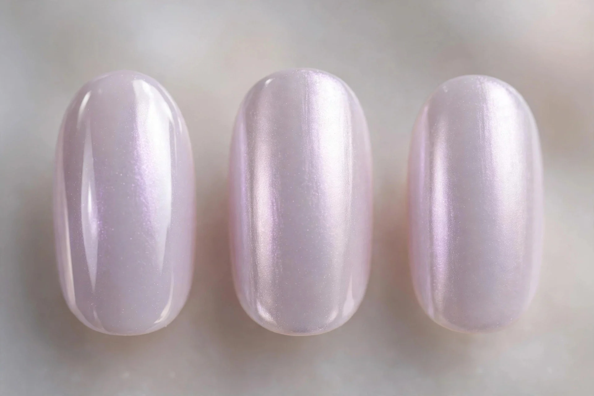 Milky lilac nails with pearl chrome glaze, short almond, luminous