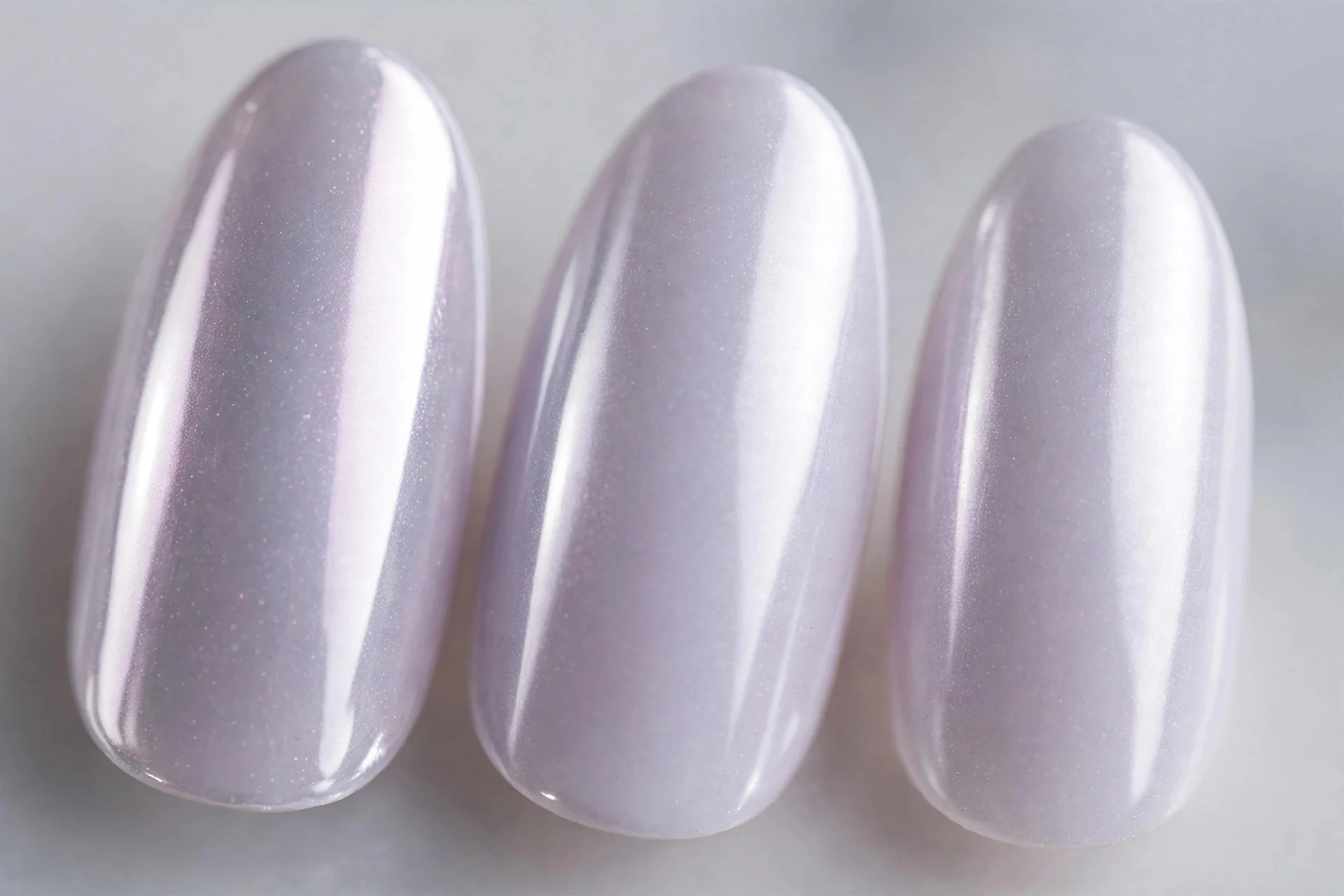 Frosty pale lilac chrome nails, medium almond, mirror shine