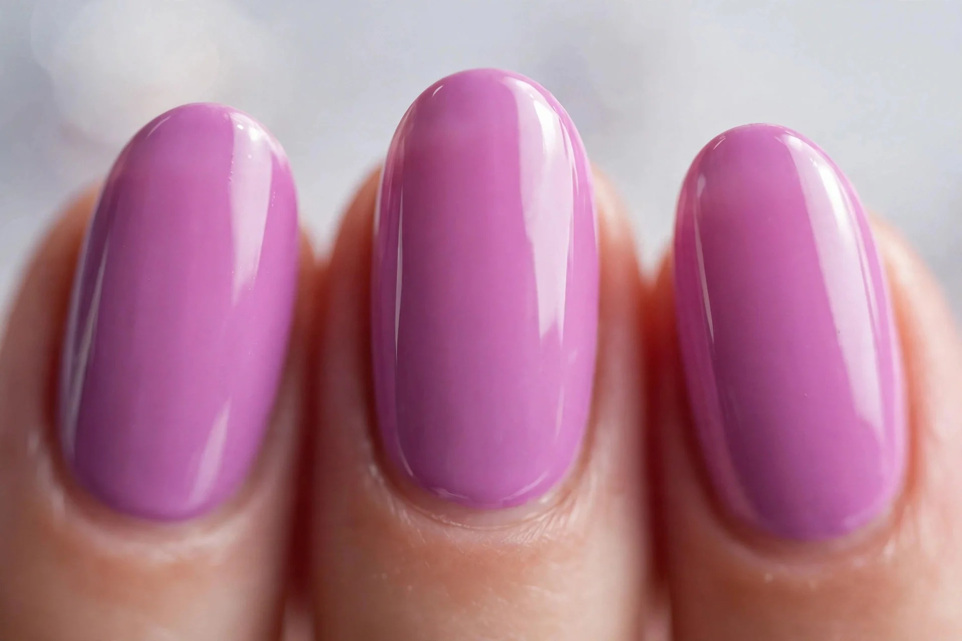 Saturated pink-purple lilac cream polish, medium almond nails, glossy